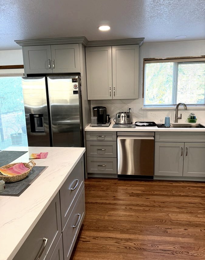 Kitchen renovation, Grey shaker cabinetry · quartz island · full-height splash
